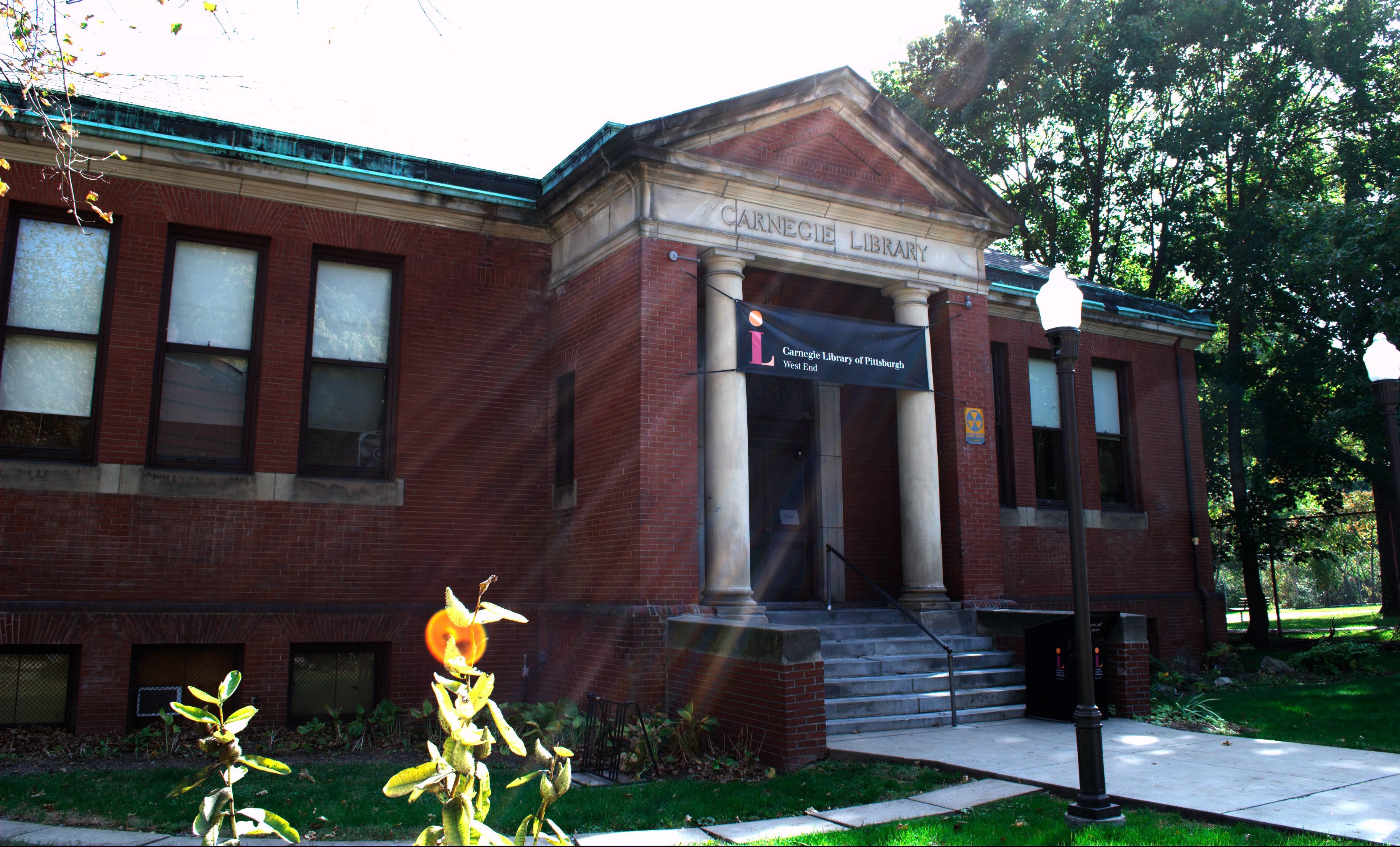 Photograph of the West End Branch of The Carnegie Library of Pittsburgh, with Civil Defense sign on facade, before 2014 rehabilitation